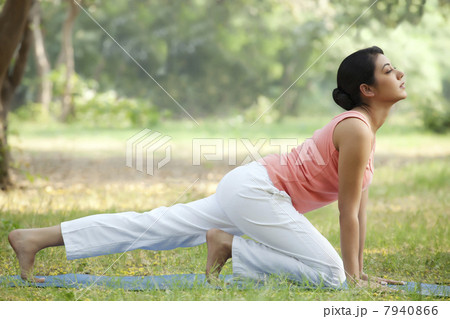 Young woman in lawn stretching 7940866