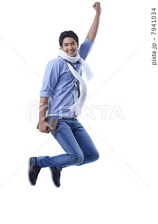 Portrait of college student jumping over white background 7941034