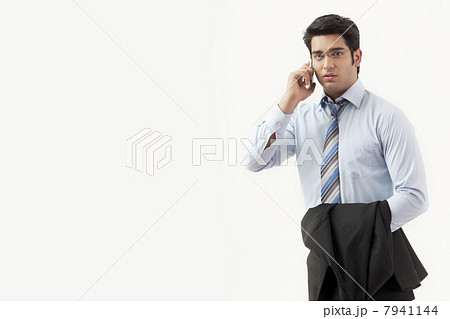 Portrait of a businessman talking on mobile phone 7941144