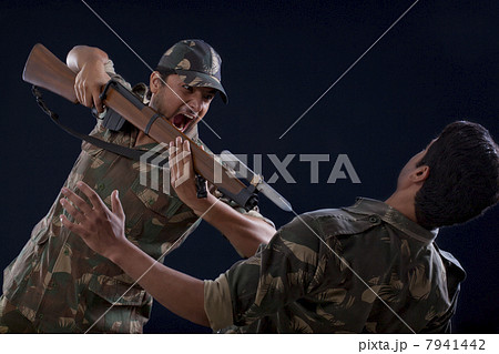 Soldiers fighting over colored background Soldiers fighting over colored background 7941442