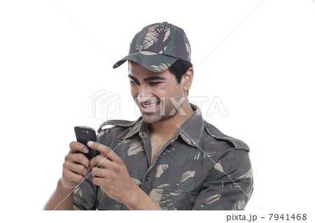 Happy soldier text messaging 7941468