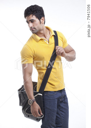 Stylish man with duffle bag looking away 7941506