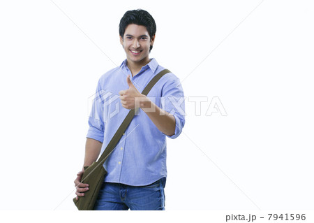 College student showing thumbs up sign over white background College student showing thumbs up sign over white background 7941596