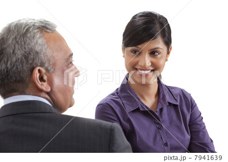 Business executives conversing on white background 7941639
