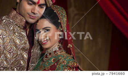 Portrait of bride resting her head on mans shoulder Portrait of bride resting her head on mans shoulder 7941660
