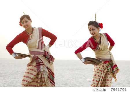 Portrait of Bihu women dancing with brass plates 7941791