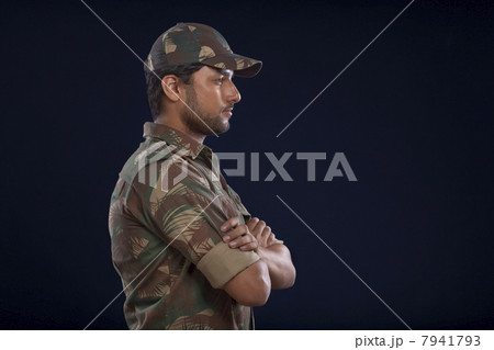 Young soldier with arms crossed 7941793