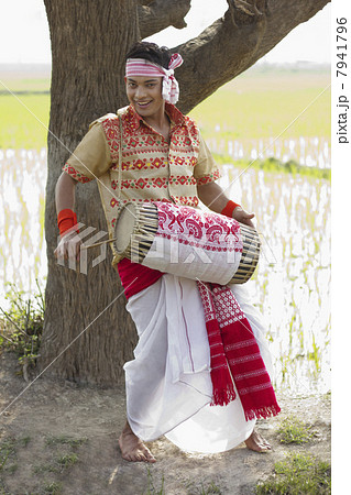 Portrait of Bihu man playing on a dhol 7941796