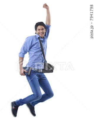 Portrait of college student jumping 7941798