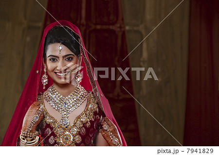 Portrait of an Indian bride in traditional clothing and jewelry Portrait of an Indian bride in traditional clothing and jewelry 7941829