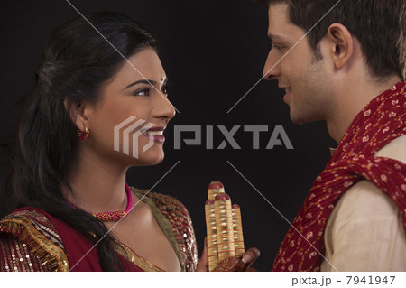 Couple with sticks 7941947