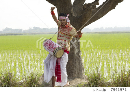 Portrait of Bihu man playing on a dhol Portrait of Bihu man playing on a dhol 7941971