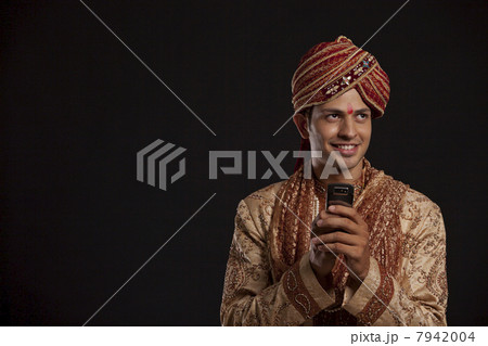 Gujarati groom with a mobile phone 7942004
