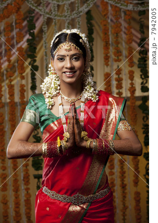 Portrait of woman with hands clasped 7942005