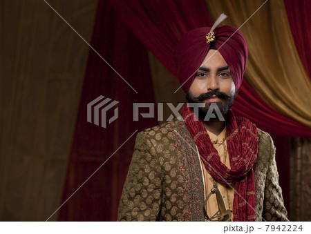 Portrait of young man in wedding dress 7942224