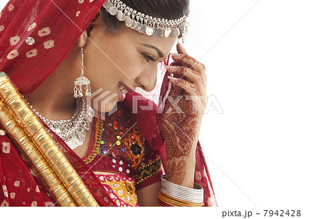 Female dandiya dancer with sticks 7942428