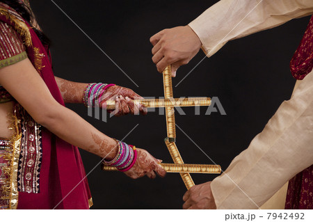 Couple with sticks dancing 7942492