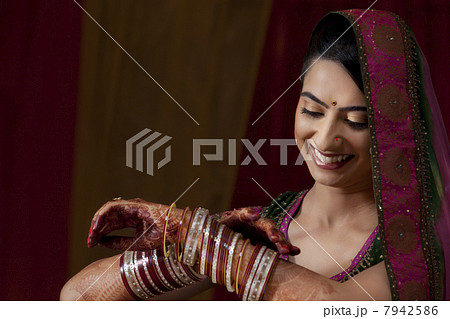 Indian bride admiring her bangles 7942586