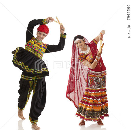 Couple performing dandia dance 7942590