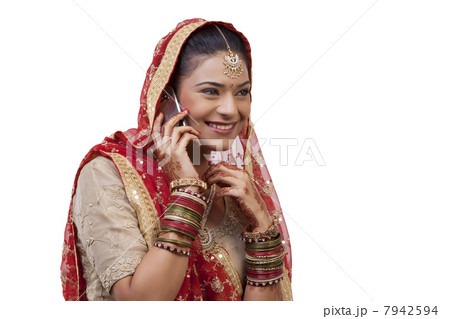 Gujarati bride talking on a mobile phone 7942594