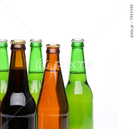Closed bottles of beer on a white background Closed bottles of beer on a white background 7943380