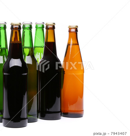 Closed bottles of beer on a white background Closed bottles of beer on a white background 7943407