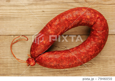 Krakow sausage isolated on the wooden table 7946050