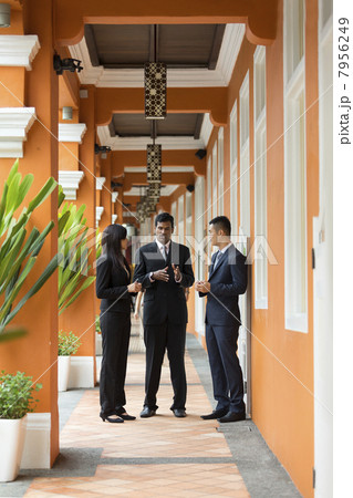 Team of Asian business people outside 7956249