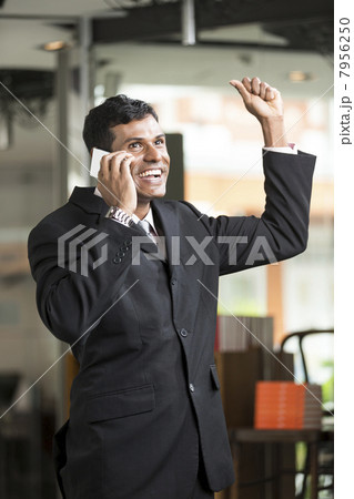 Indian Business man talking on phone Indian Business man talking on phone 7956250
