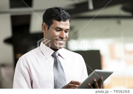 Indian Business man using an iPad 7956268