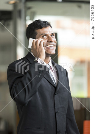 Indian Business man talking on phone Indian Business man talking on phone 7956408