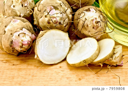 Jerusalem artichokes cut on the board 7959808