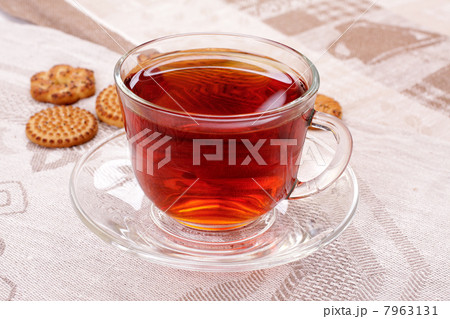 Cup of hot tea and cookies on a napkin Cup of hot tea and cookies on a napkin 7963131