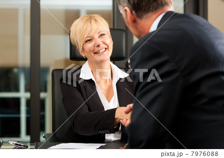 Female Lawyer or notary in her office 7976088