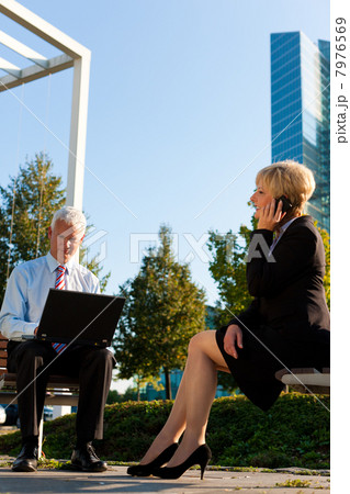 Business people working outdoors 7976569
