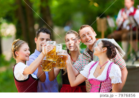 In Beer garden - friends in front of band In Beer garden - friends in front of band 7976856