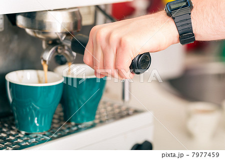 Coffeeshop - barista presents coffee 7977459