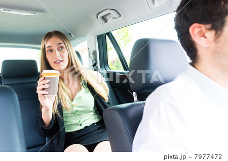 Woman traveling in taxi, she has an appointment Woman traveling in taxi, she has an appointment 7977472