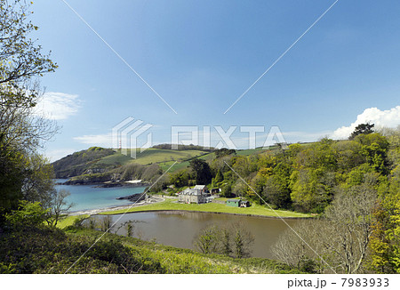 Cottage and lake at Polridmouth Beach, Cornwall, UK. Cottage and lake at Polridmouth Beach, Cornwall, UK. 7983933