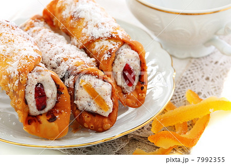 Cannoli with fresh ricotta and candied fruit. 7992355
