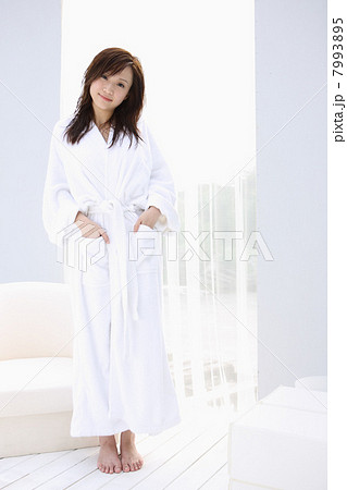 Girl in bathrobe standing Girl in bathrobe standing 7993895