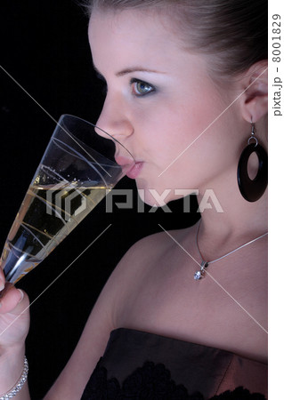Beautiful blonde with a champagne glass. Beautiful blonde with a champagne glass. 8001829