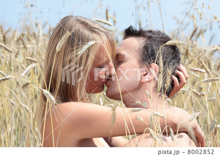 A beautiful couple in wheat field A beautiful couple in wheat field 8002852