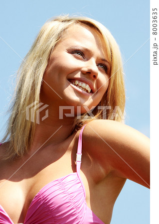 Young blond woman in bikini outdoors 8003635