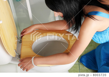 Young caucasian woman in toilet Young caucasian woman in toilet 8003720