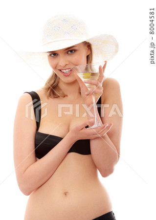 Summer girl drinking martini Summer girl drinking martini 8004581