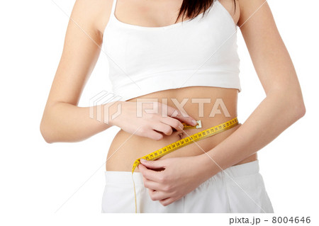 Woman measuring her waist Woman measuring her waist 8004646