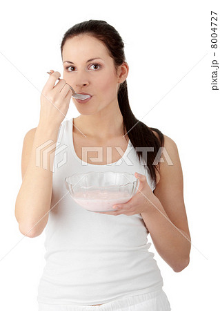 Female eating yoghurt Female eating yoghurt 8004727