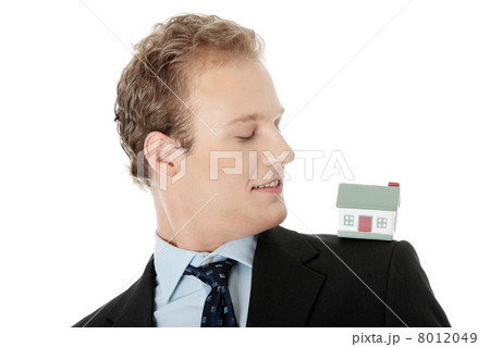 Young business man with house model 8012049