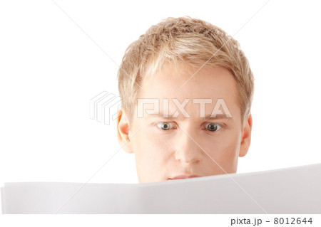 Successful young businessman reading blank card Successful young businessman reading blank card 8012644